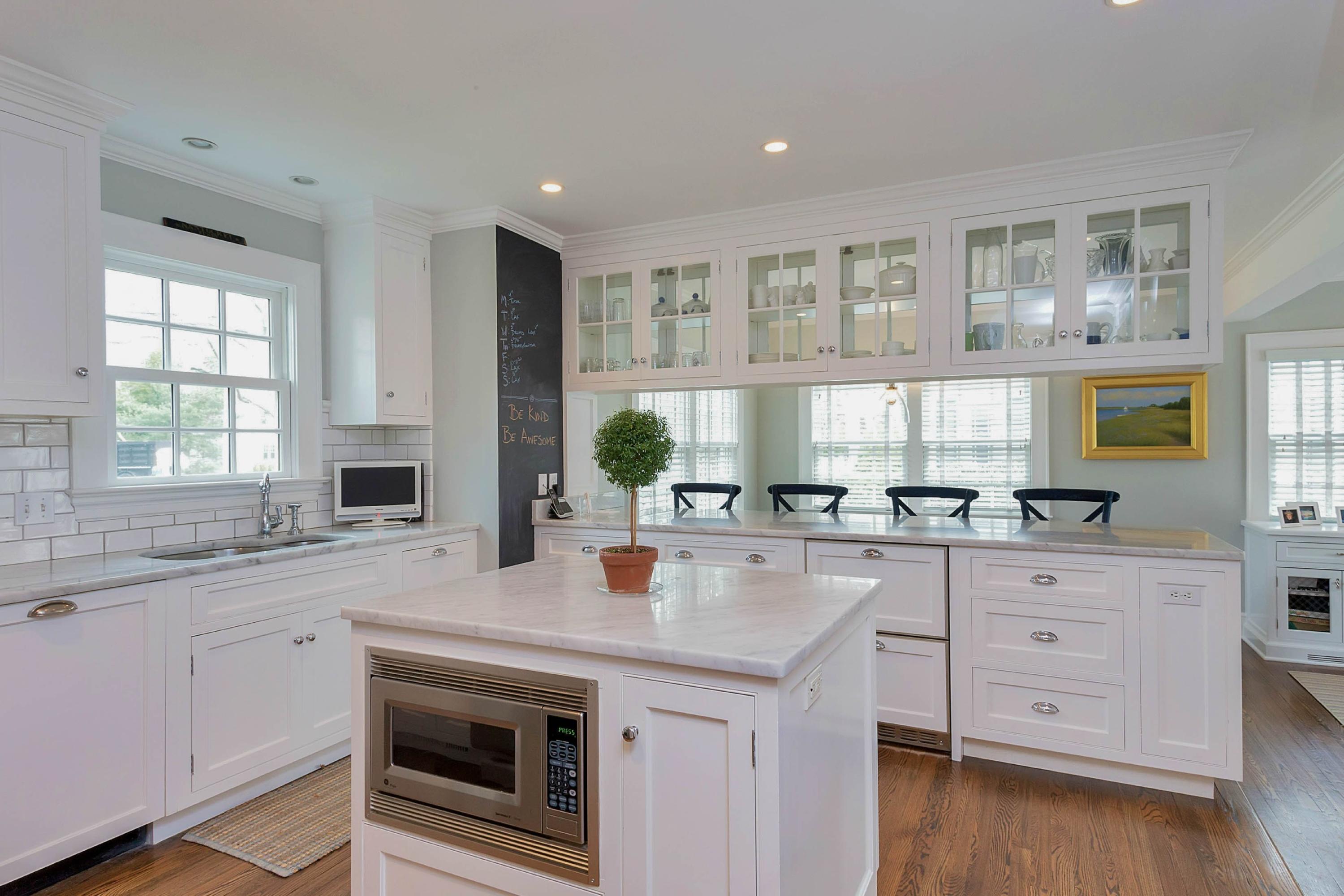 6 Sunset Road Darien, CT 06820 - Photo 8 of 24 a kitchen with a sink stove and cabinets