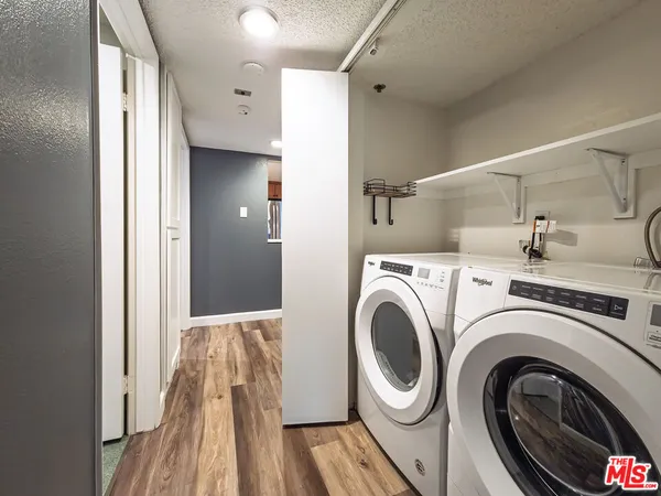 a view of hallway with washer and dryer