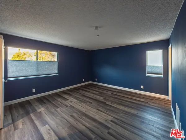wooden floor and windows in an empty room