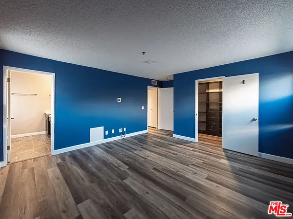 a view of a livingroom with wooden floor