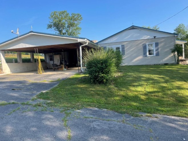 5210 Ditty Road Cookeville, TN 38506 - Photo 16 of 17 a front view of a house with a yard