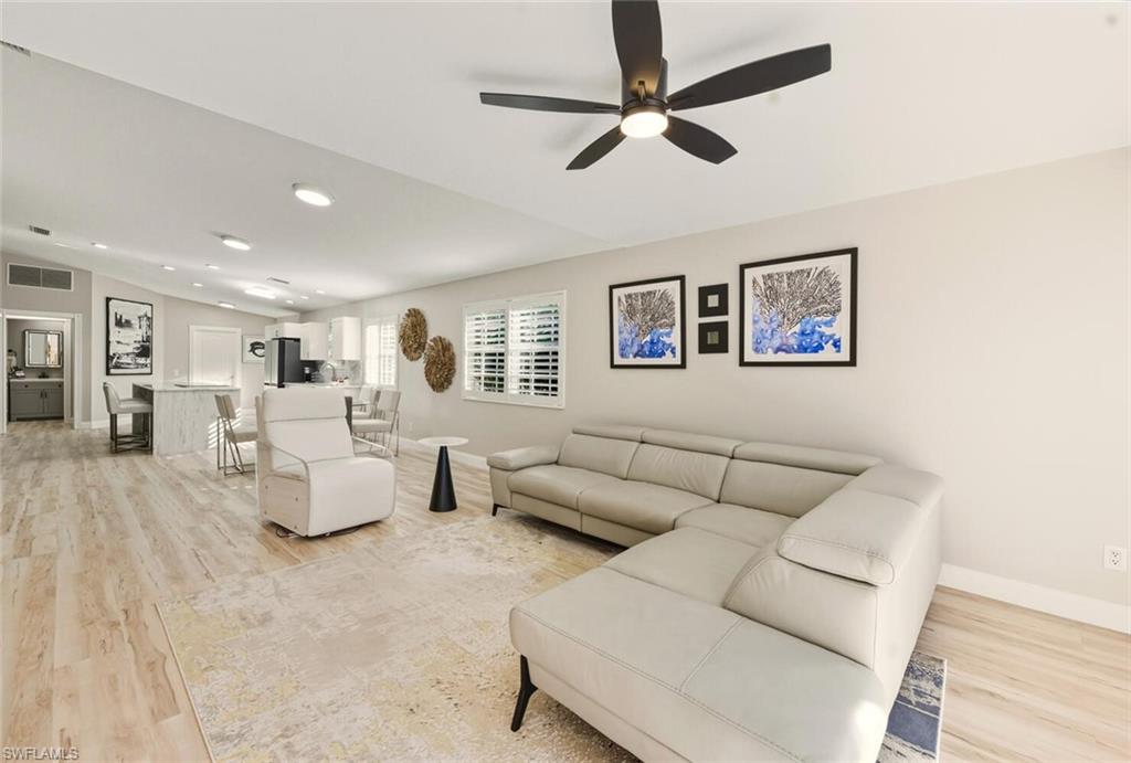3408 Cayman Lane Naples, FL 34119 - Photo 14 of 34 a living room with furniture and a ceiling fan