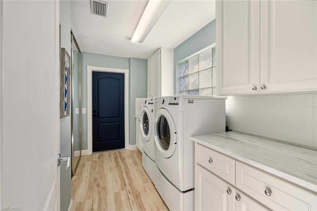 3408 Cayman Lane Naples, FL 34119 - Photo 20 of 34 a utility room with dryer and washer