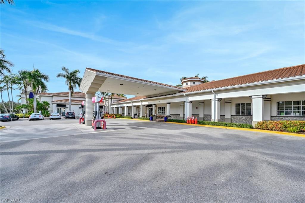 3408 Cayman Lane Naples, FL 34119 - Photo 27 of 34 front view of a building with a patio