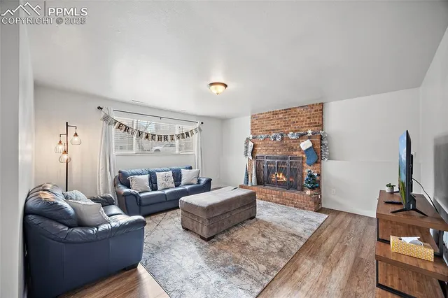 a living room with furniture and a flat screen tv