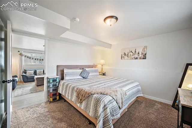 a bedroom with a bed and a table