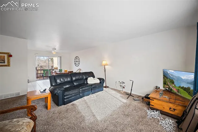 a living room with furniture and a table