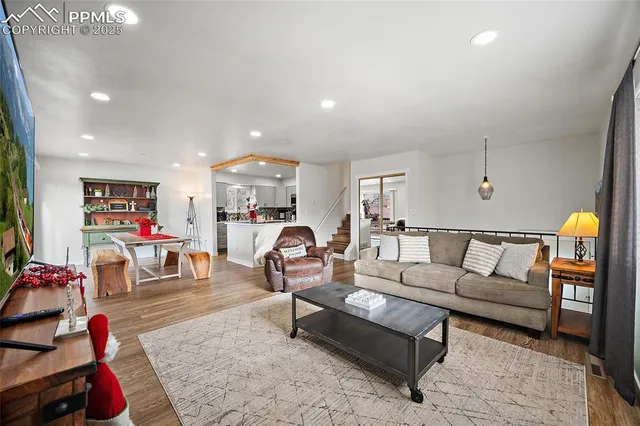 a living room with furniture and a flat screen tv