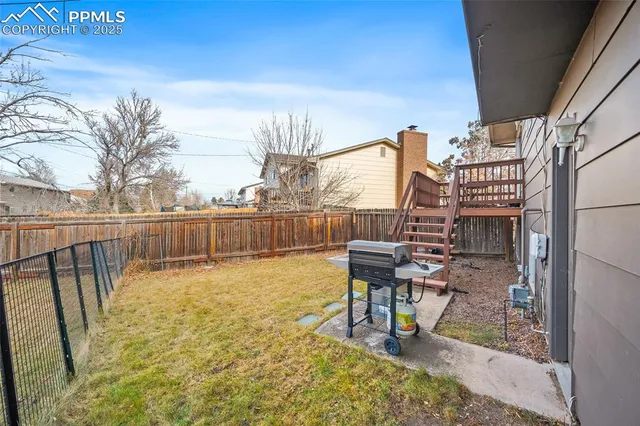 a view of a chairs and table in patio