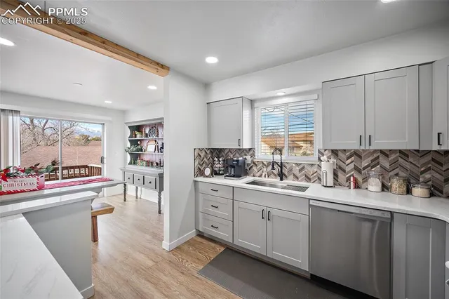 a kitchen with a sink cabinets and window