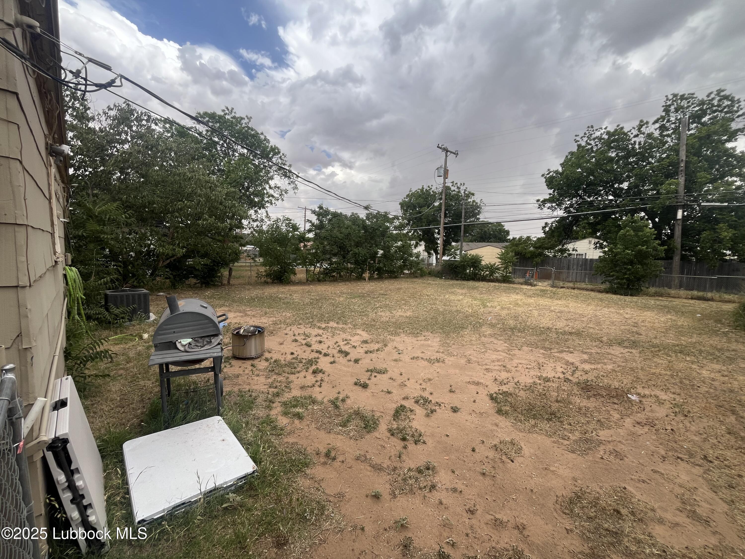 2709 41st Street Lubbock, TX 79413 - Photo 7 of 7 a backyard of a house with table and chairs