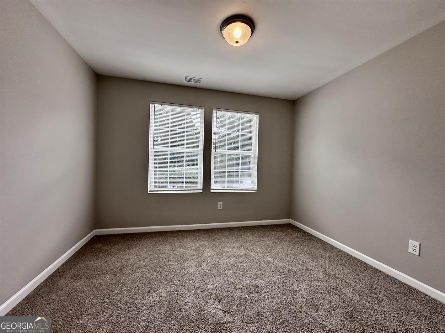 308 Reedell Way Villa Rica, GA 30180 - Photo 11 of 16 an empty room with a window