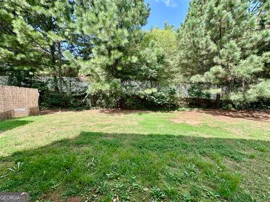 a view of a yard with a tree