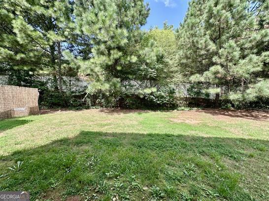308 Reedell Way Villa Rica, GA 30180 - Photo 16 of 16 a view of a yard with a tree