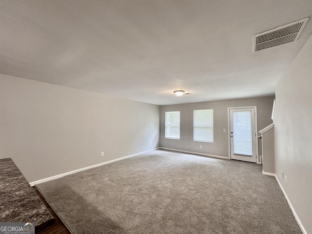 308 Reedell Way Villa Rica, GA 30180 - Photo 2 of 16 an empty room with windows