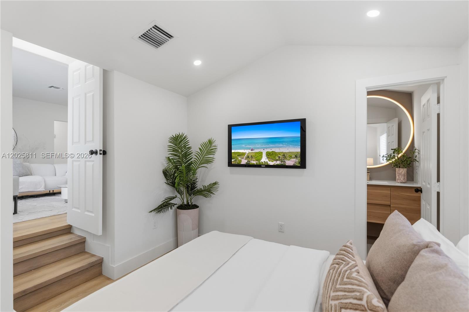 2110 Southwest 15th Street Miami, FL 33145 - Photo 27 of 37 a bedroom with a bed and a potted plant
