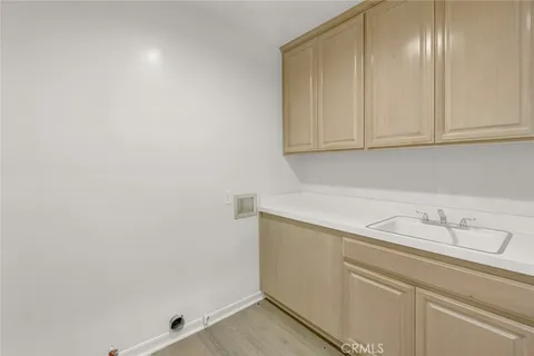 a view of storage and utility room with cabinets