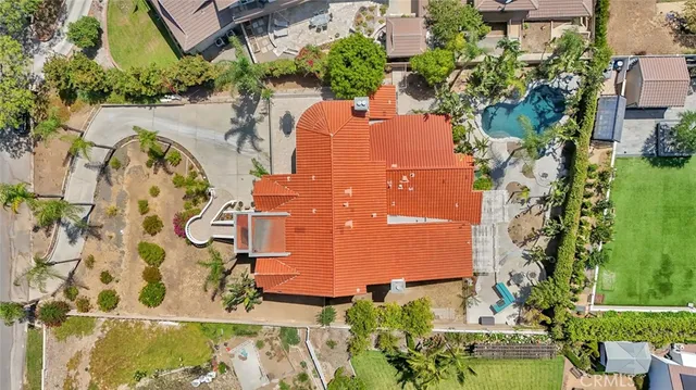 an aerial view of a house with a yard