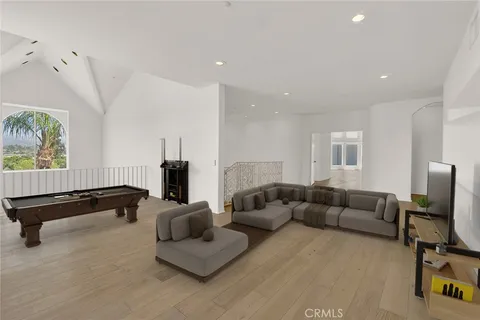 a living room with furniture ceiling fan and a window