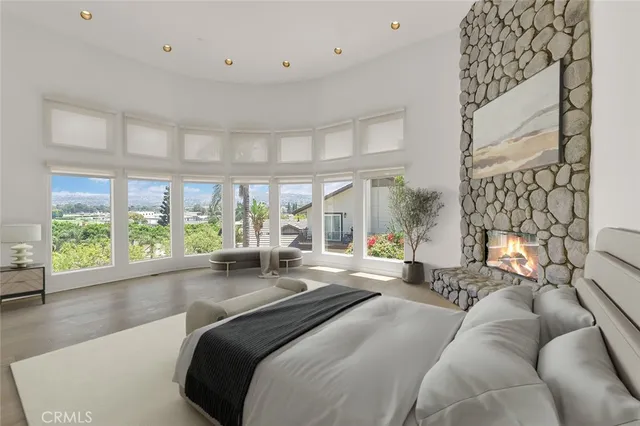 a spacious bedroom with a large bed and a large window