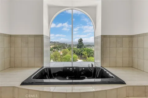 a bathroom with a granite countertop sink mirror and