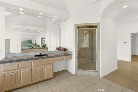 a view of swimming pool with a table and chairs in patio