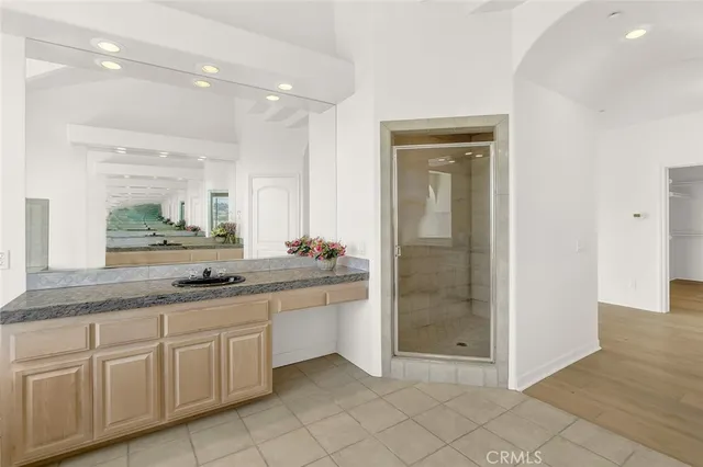 a view of swimming pool with a table and chairs in patio