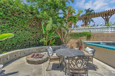 a view of a backyard with large trees