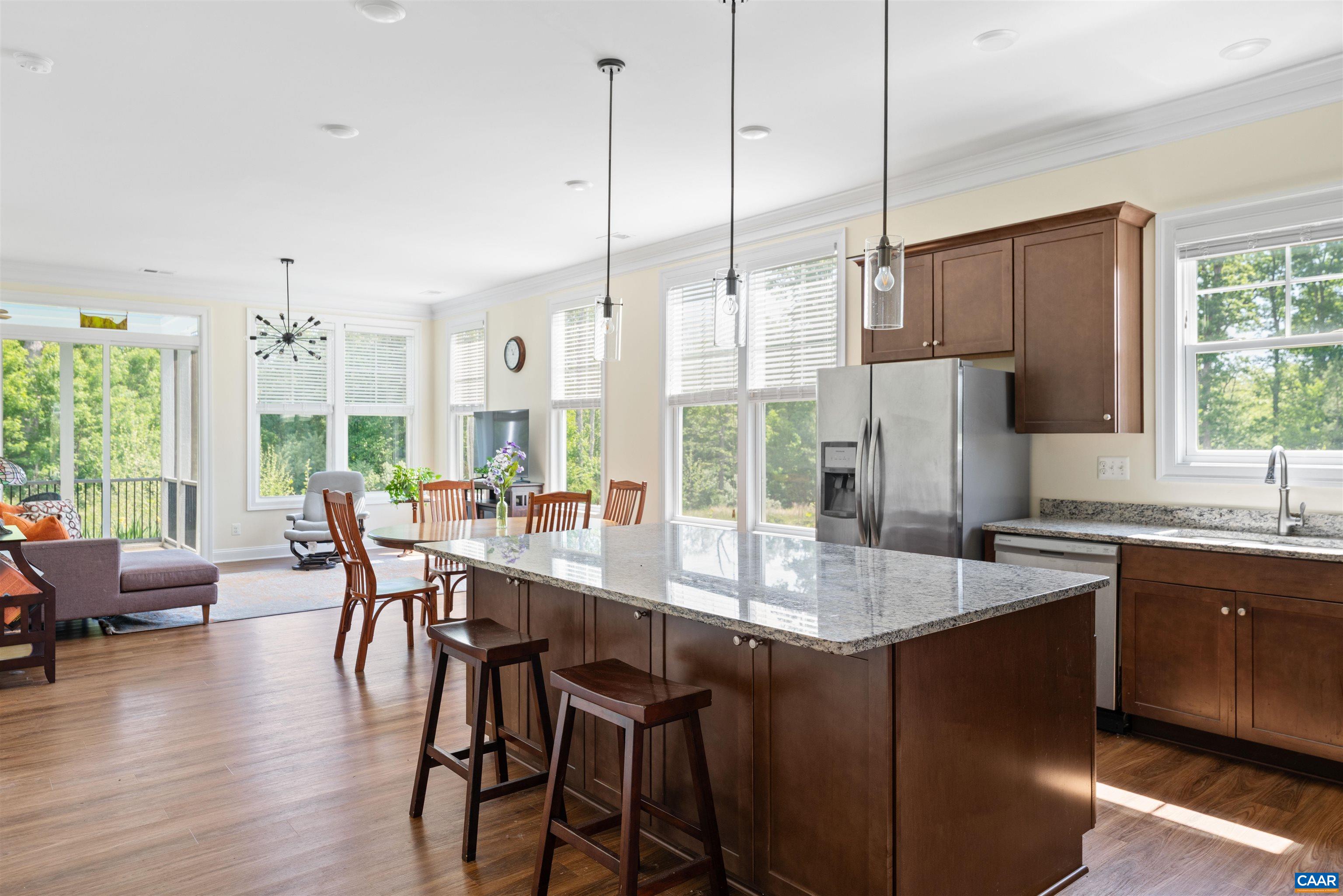 322 Claibourne Road Crozet, VA 22932 - Photo 3 of 25 a kitchen with stainless steel appliances granite countertop a stove a refrigerator a kitchen island a sink cabinets and wooden floor