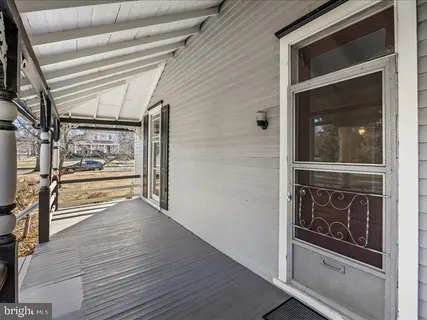 a view of an entryway with wooden floor