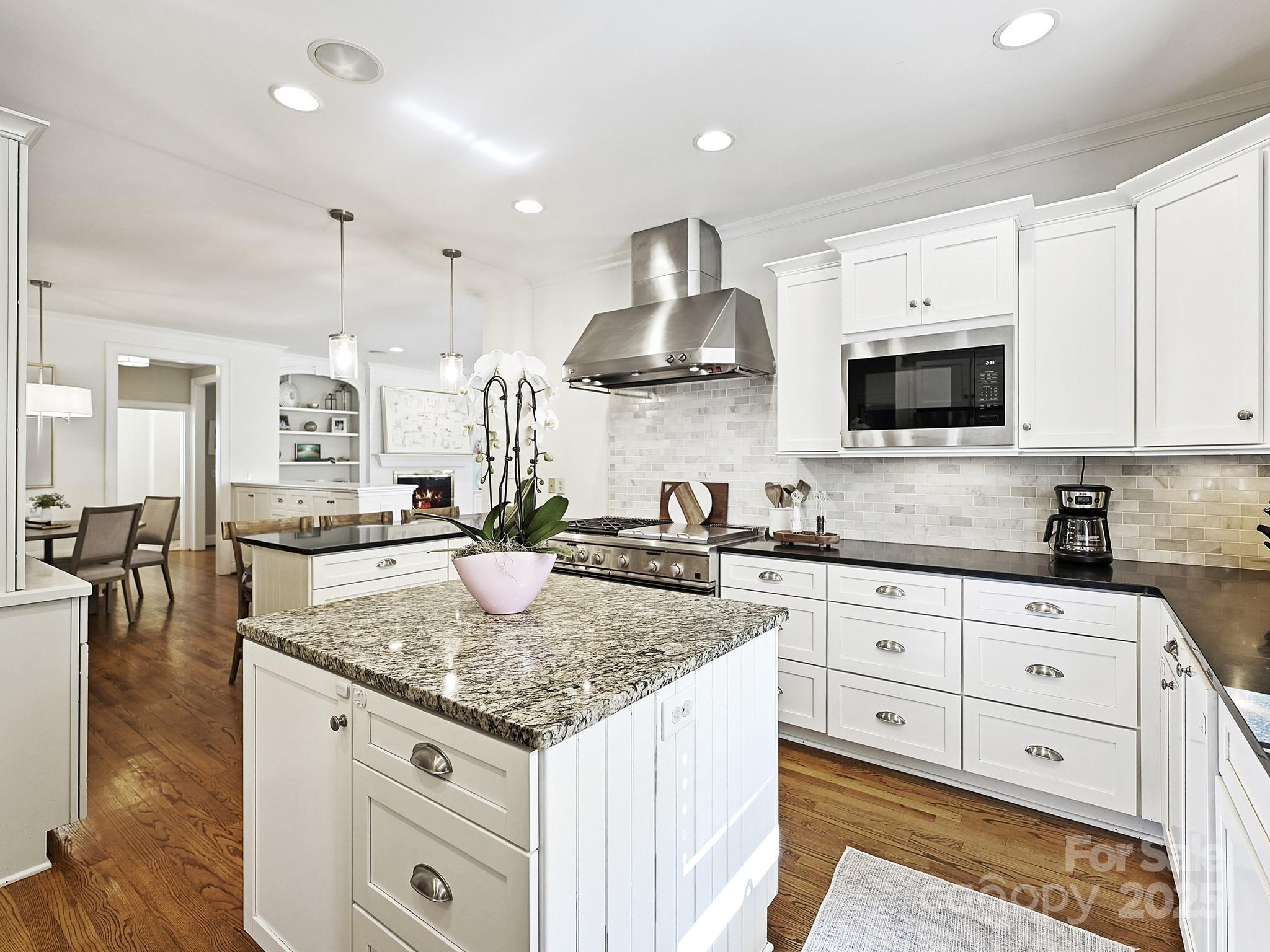 3915 Ayscough Road Charlotte, NC 28211 - Photo 14 of 45 a open kitchen with granite countertop a sink a stove and cabinets