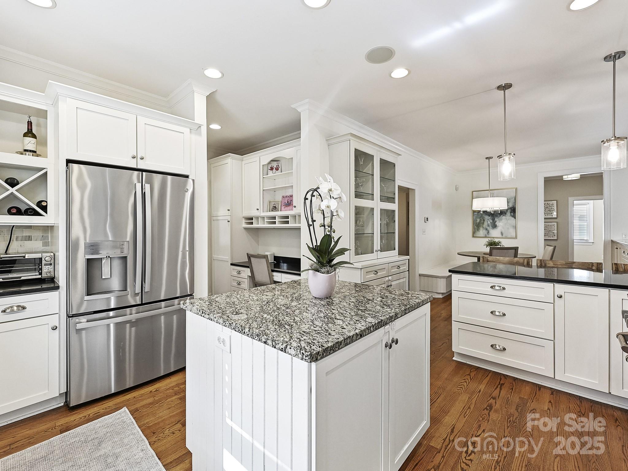 3915 Ayscough Road Charlotte, NC 28211 - Photo 15 of 45 a kitchen with stainless steel appliances granite countertop a sink stove and refrigerator