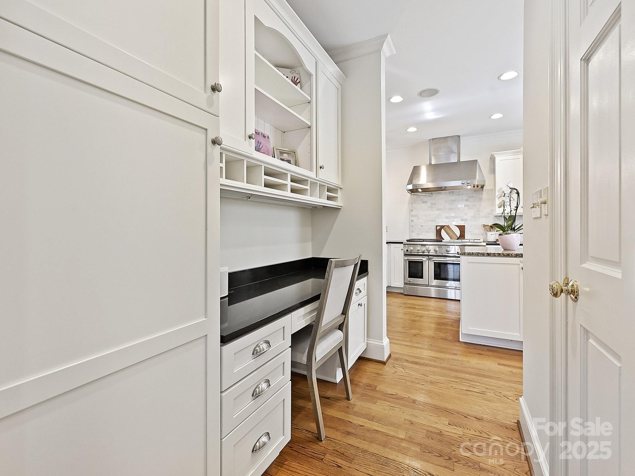 3915 Ayscough Road Charlotte, NC 28211 - Photo 17 of 45 a kitchen with white cabinets and appliances