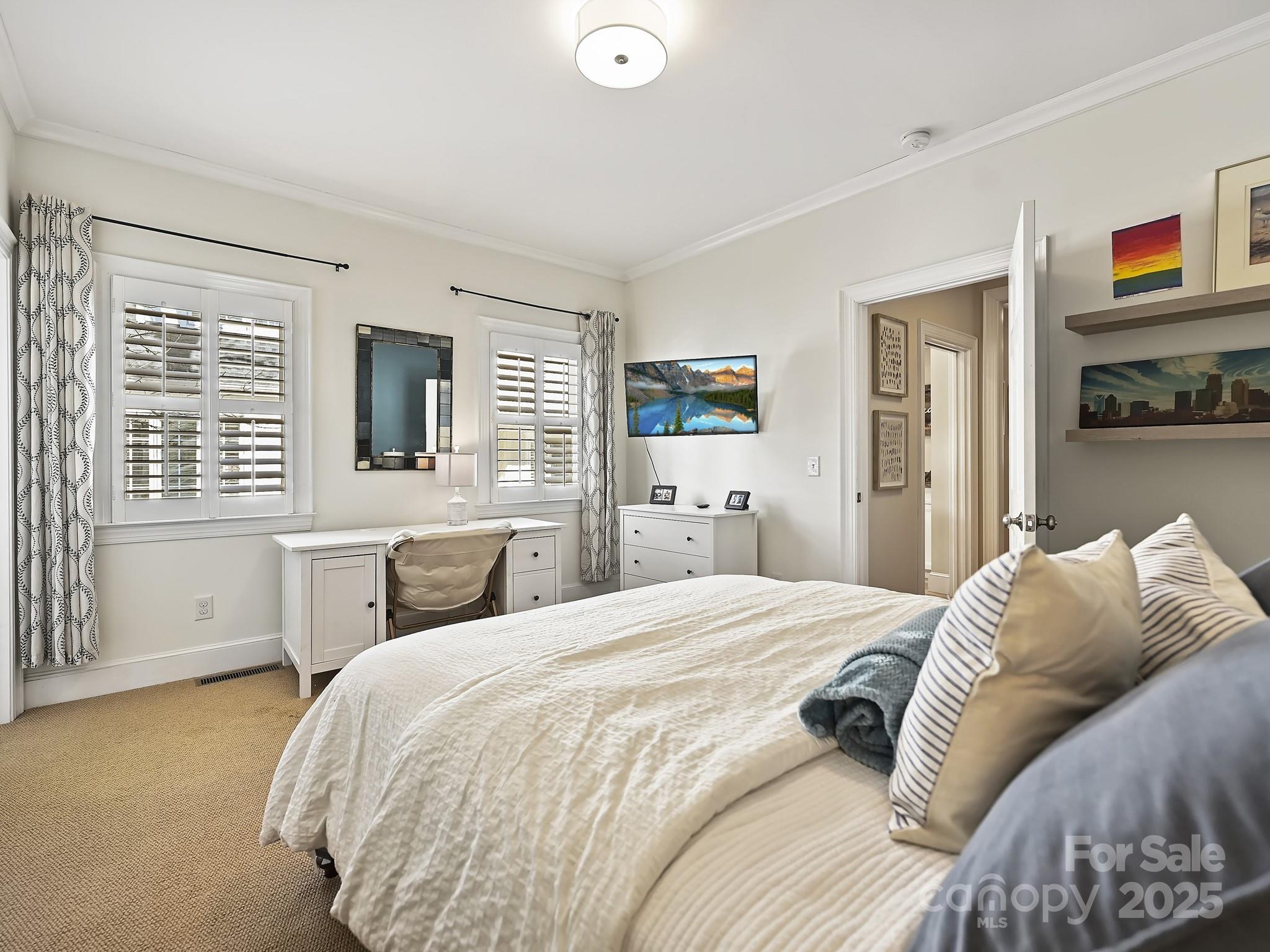 3915 Ayscough Road Charlotte, NC 28211 - Photo 22 of 45 a bedroom with a bed and a couch