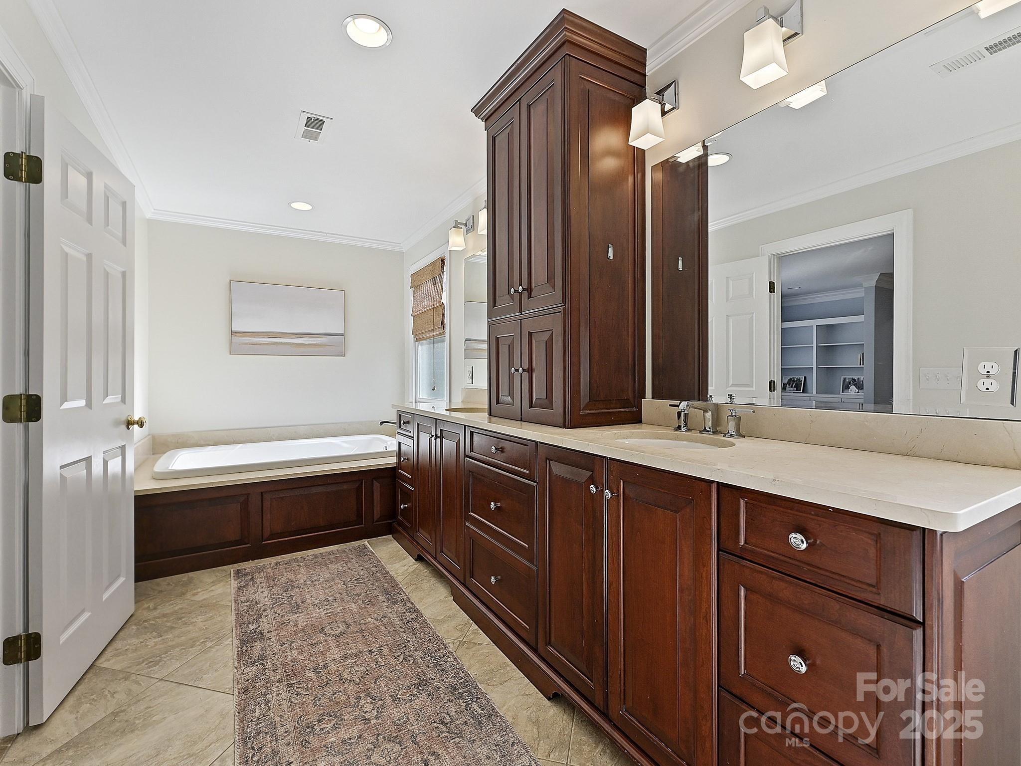 3915 Ayscough Road Charlotte, NC 28211 - Photo 30 of 45 a large bathroom with a large tub and sink