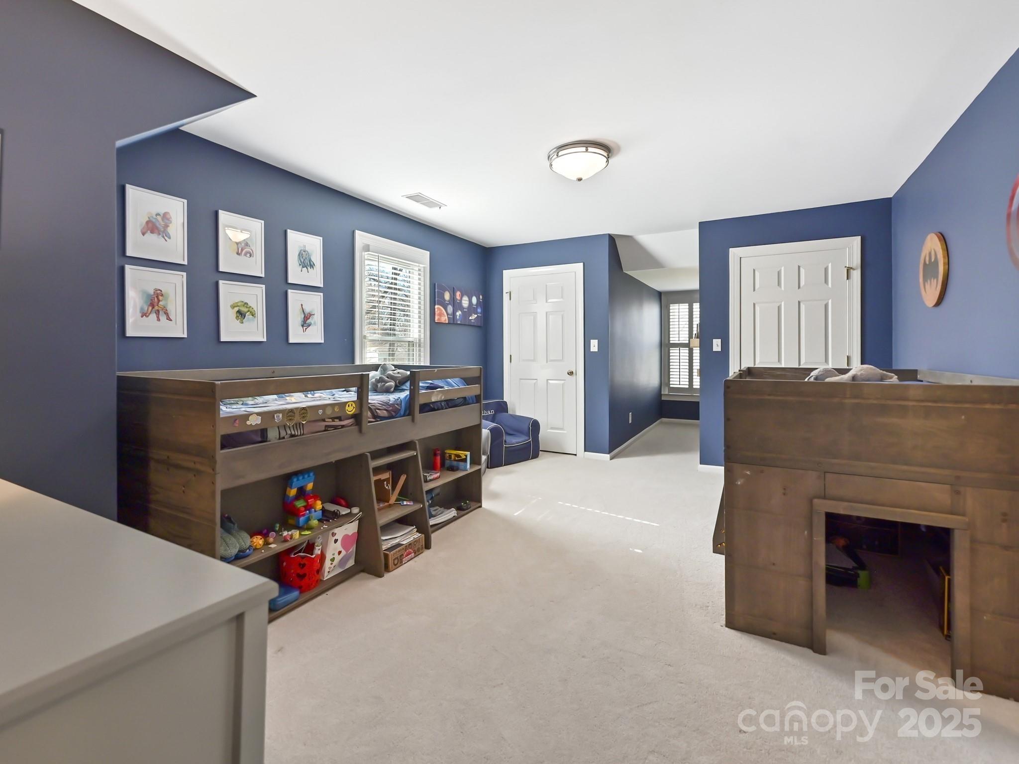 3915 Ayscough Road Charlotte, NC 28211 - Photo 35 of 45 a bed room with a bed and a television