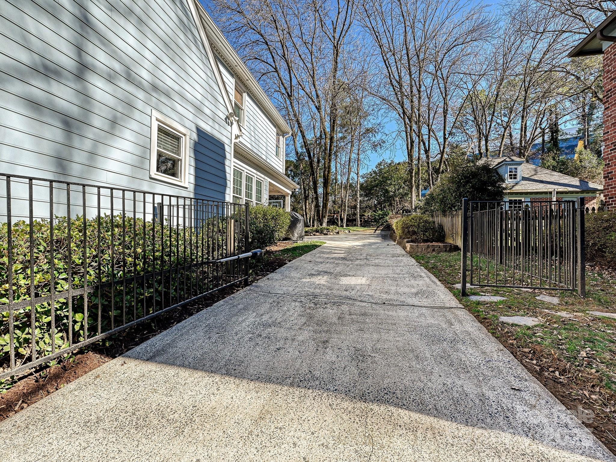 3915 Ayscough Road Charlotte, NC 28211 - Photo 43 of 45 a view of a pathway with a house