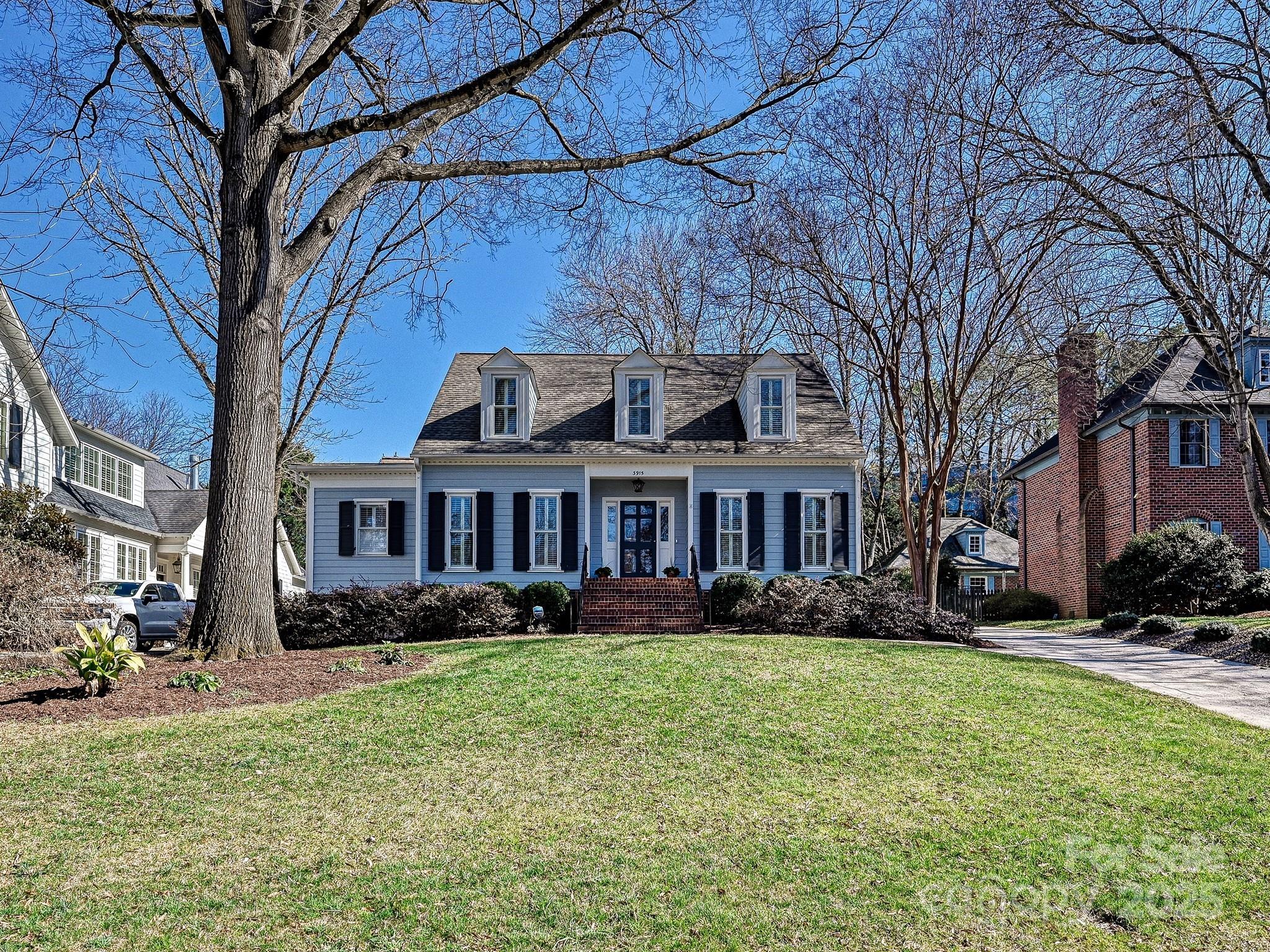 3915 Ayscough Road Charlotte, NC 28211 - Photo 45 of 45 a front view of a house with garden and trees