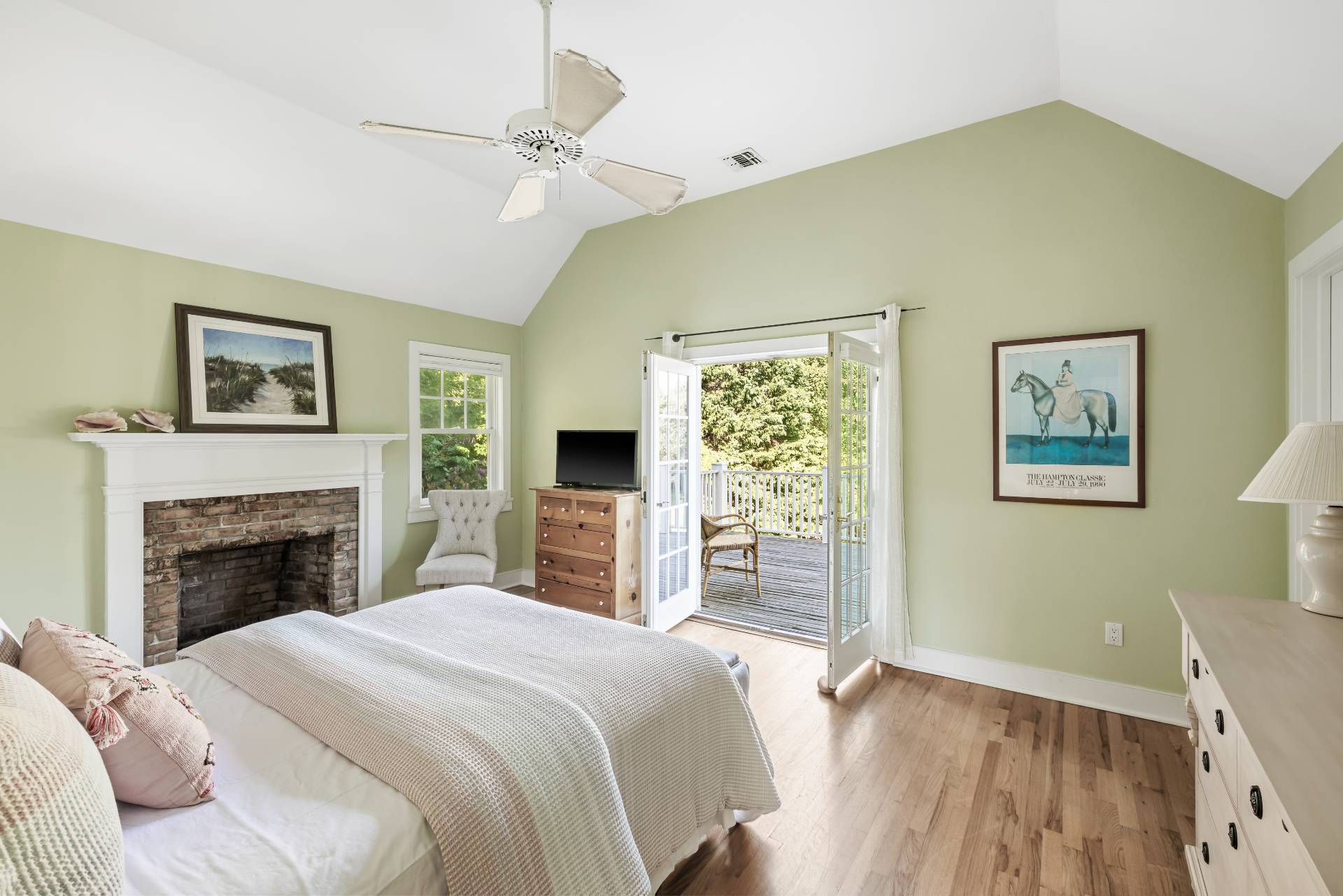 10 Aelfie's Way Bridgehampton, NY 11932 - Photo 15 of 23 a bedroom with a bed and a fireplace