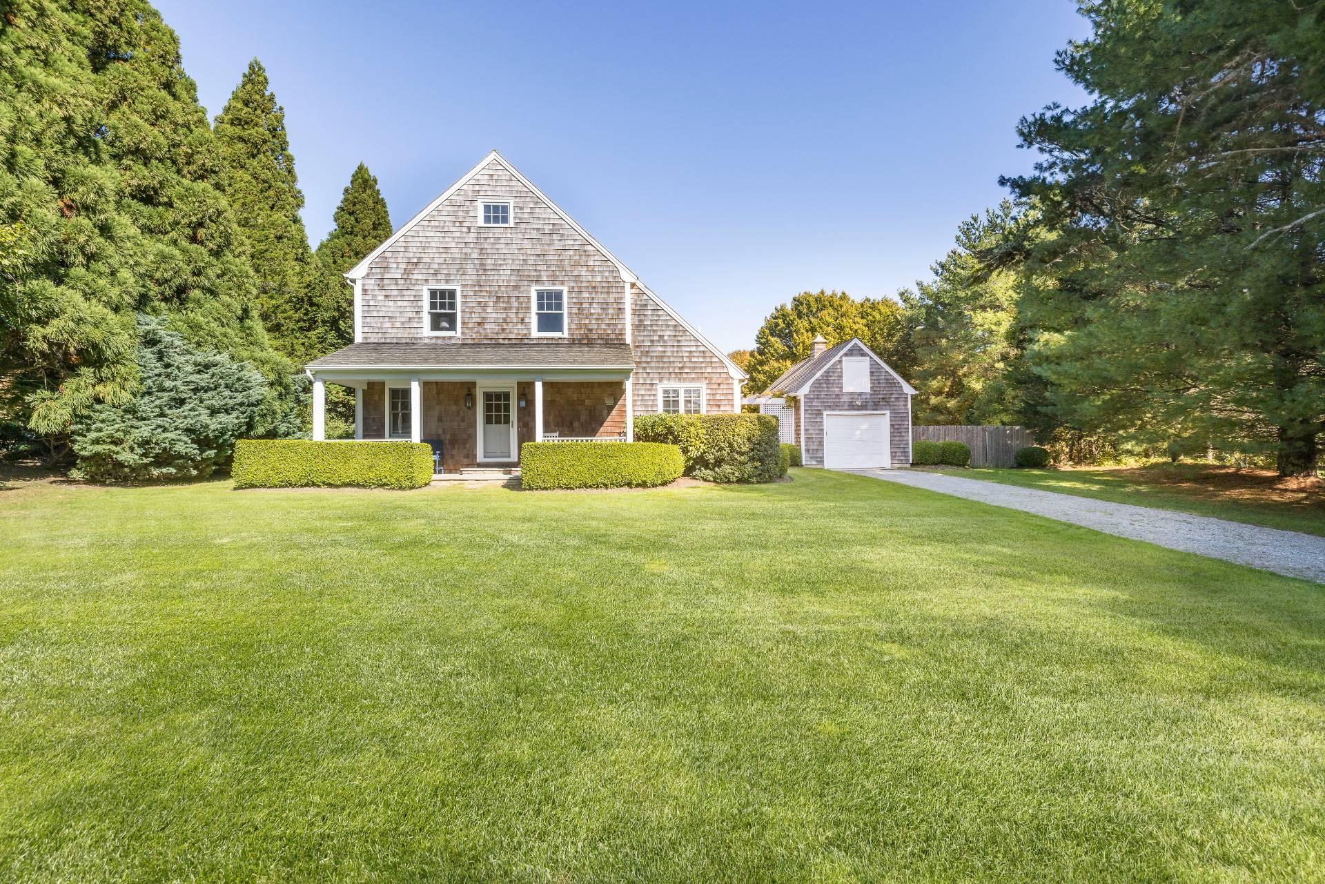10 Aelfie's Way Bridgehampton, NY 11932 - Photo 5 of 23 a front view of a house with a garden and plants