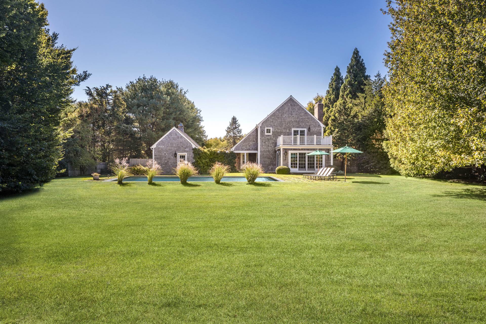 10 Aelfie's Way Bridgehampton, NY 11932 - Photo 9 of 23 a front view of a house with a yard and trees