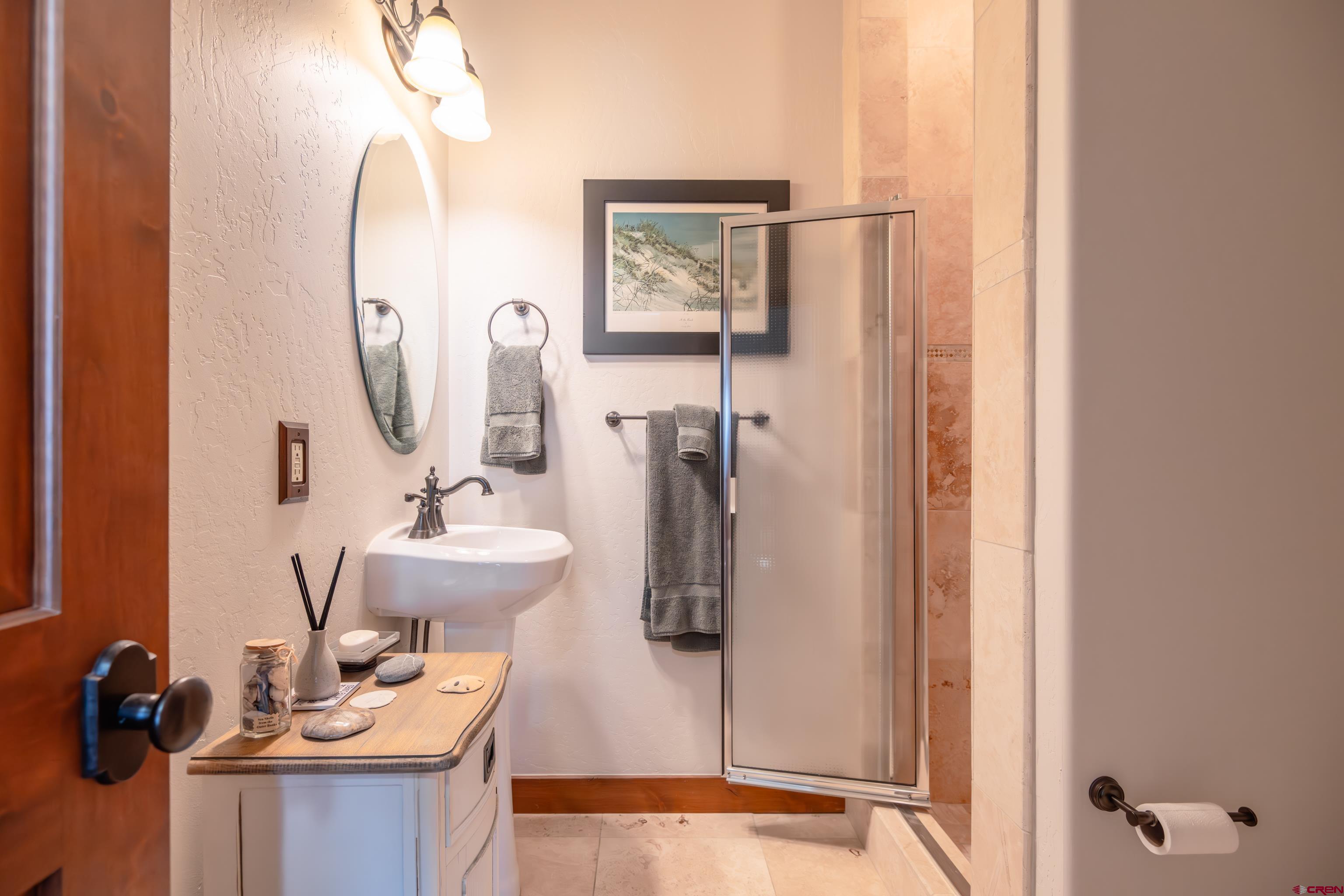 11 Castle Road Crested Butte, CO 81225 - Photo 14 of 45 a bathroom with a sink and mirror