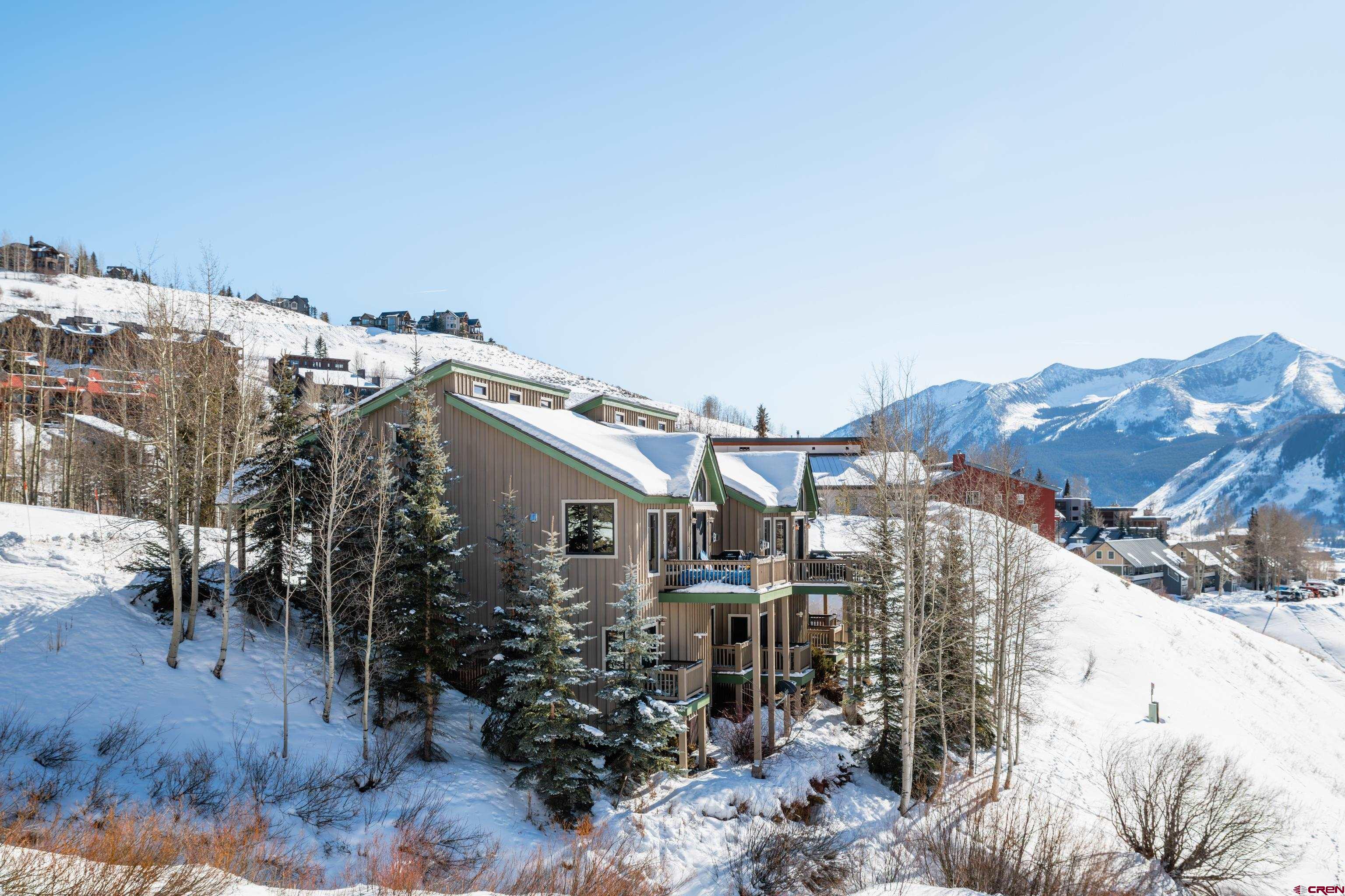 11 Castle Road Crested Butte, CO 81225 - Photo 34 of 45 a view of a house with a yard and sitting area