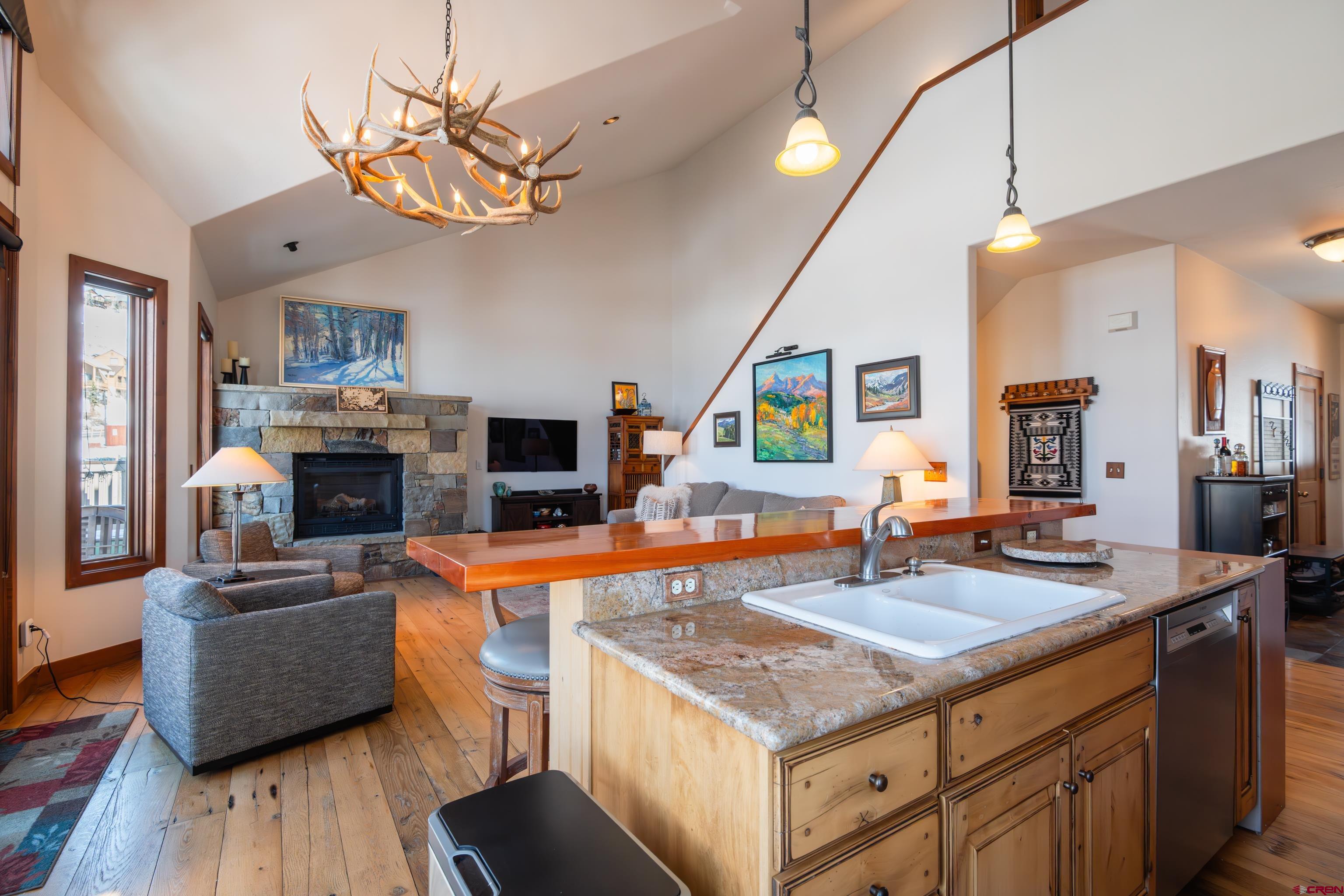 11 Castle Road Crested Butte, CO 81225 - Photo 7 of 45 a kitchen with a counter space a sink appliances and cabinets