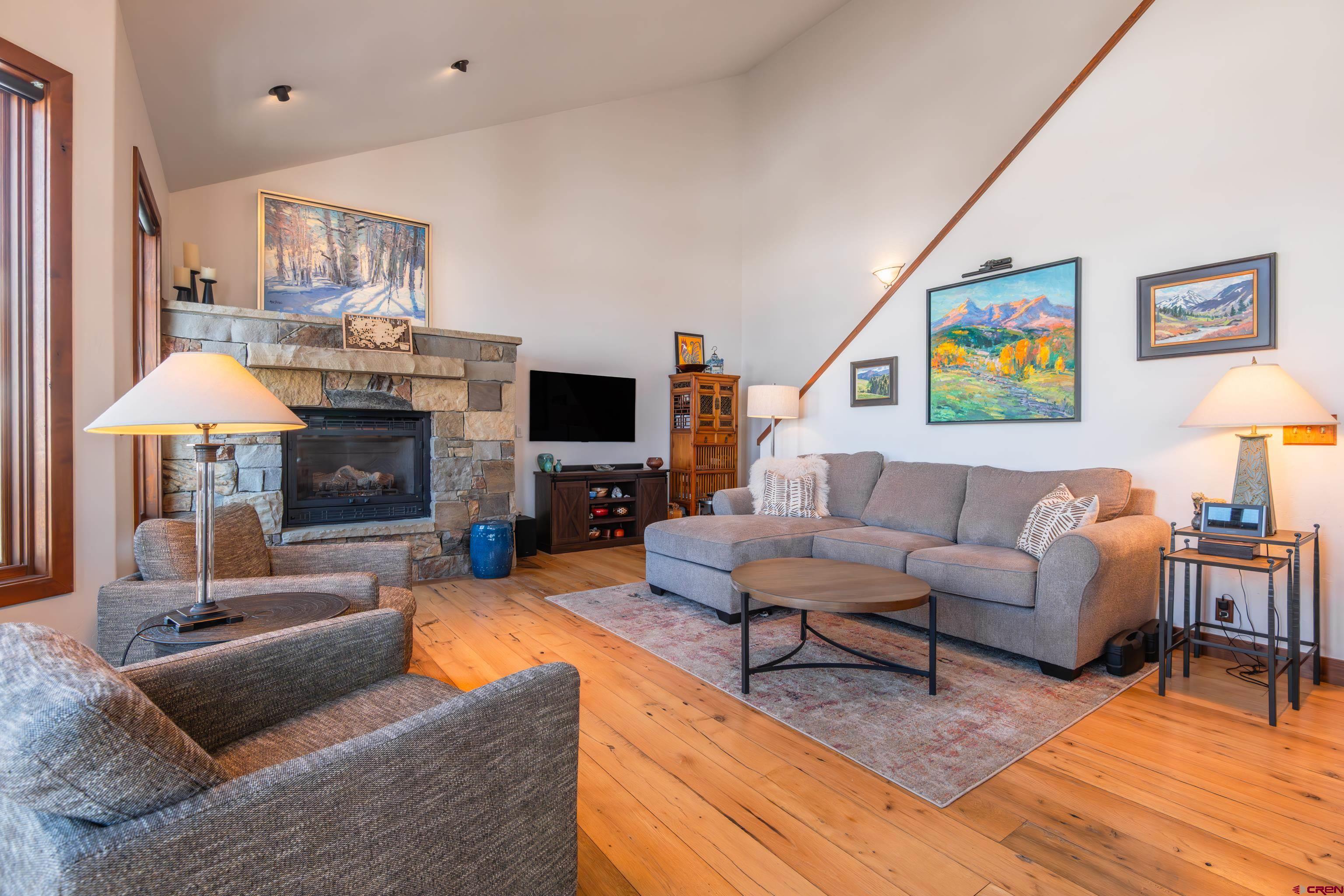 11 Castle Road Crested Butte, CO 81225 - Photo 8 of 45 a living room with furniture and a fireplace
