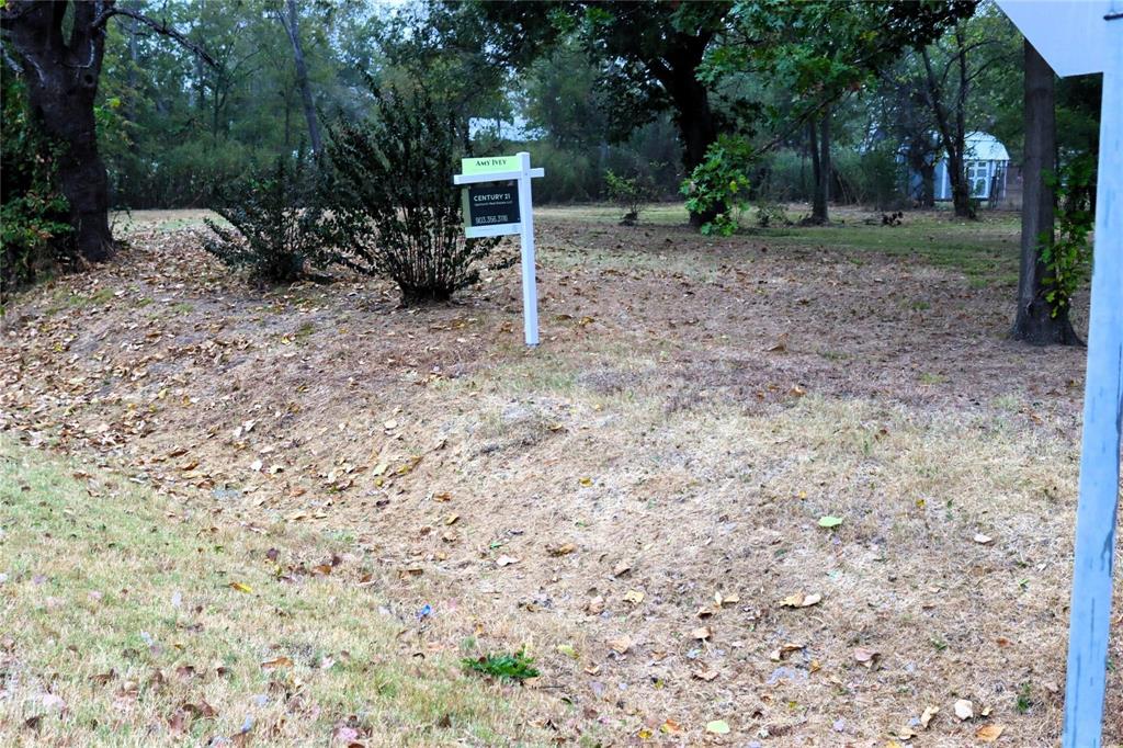 a view of a backyard with furniture and a fire pit