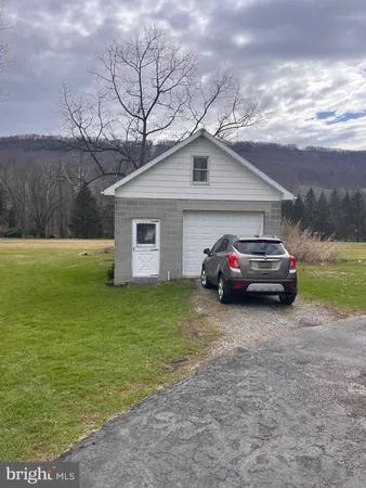 a view of a car parked in front of a house