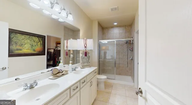 a bathroom with a sink vanity granite and a mirror