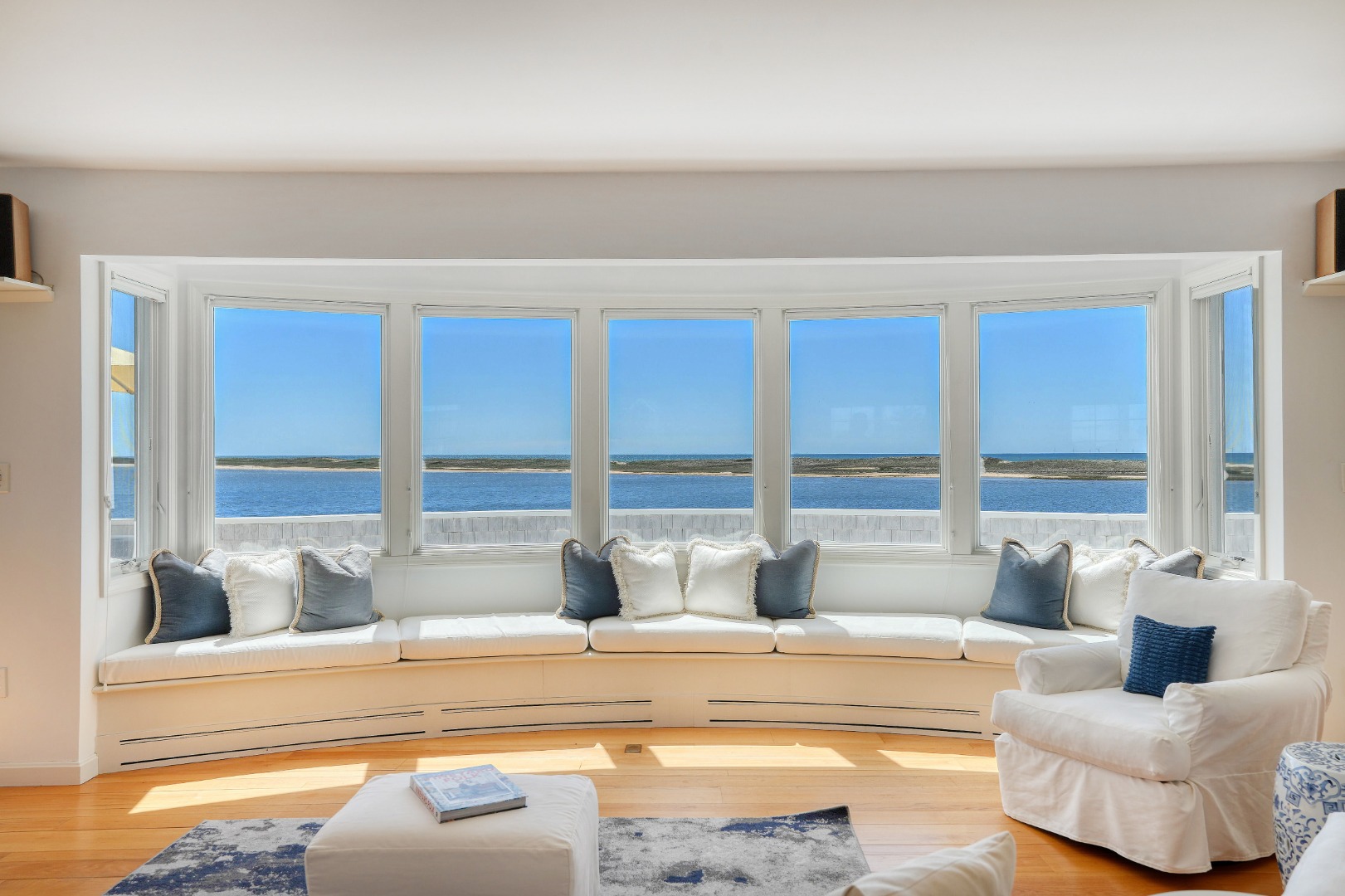 103 Edgartown Bay Road Edgartown, MA 02539 - Photo 2 of 30 The living room with expansive window wall that offers panoramic views of Katama Bay