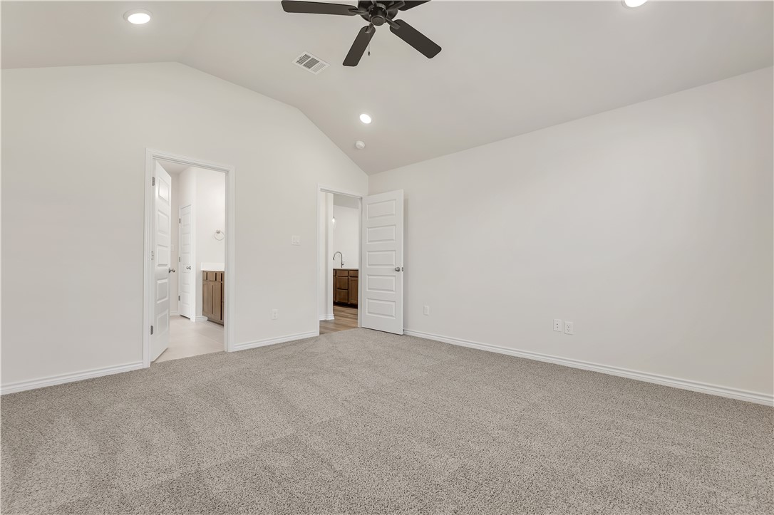 1931 Pinemont View Drive Bryan, TX 77807 - Photo 24 of 43 an empty room with a ceiling fan and window